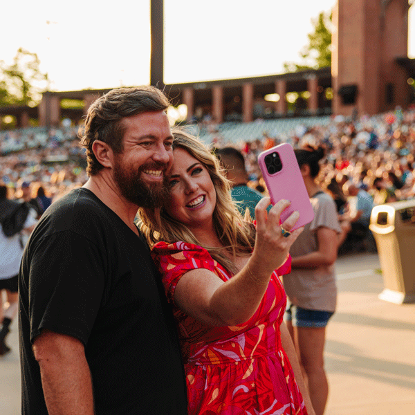 A smiling couple takes a selfie at Starlight.